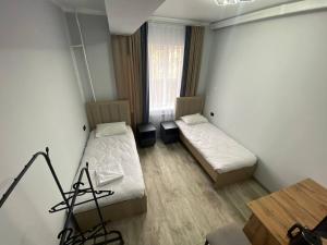 Postel nebo postele na pokoji v ubytování Bagysh Hotel