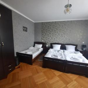 A bed or beds in a room at GIO-NIKA