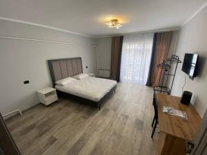 Postel nebo postele na pokoji v ubytování Bagysh Hotel