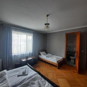 A bed or beds in a room at GIO-NIKA