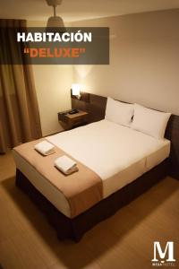 Letto o letti in una camera di Hotel Mega