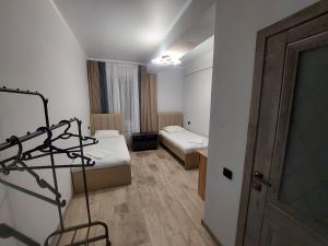 Postel nebo postele na pokoji v ubytování Bagysh Hotel