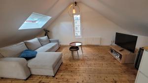 Μια τηλεόραση ή/και κέντρο ψυχαγωγίας στο Appartement cosi au cœur de la Venise Normande