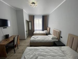 Postel nebo postele na pokoji v ubytování Bagysh Hotel