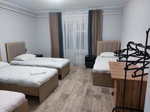 Postel nebo postele na pokoji v ubytování Bagysh Hotel