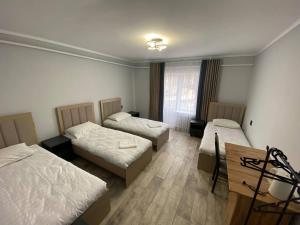 Postel nebo postele na pokoji v ubytování Bagysh Hotel