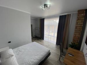 Postel nebo postele na pokoji v ubytování Bagysh Hotel