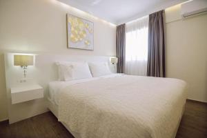 En eller flere senge i et værelse på Nobel apartment, Chania Town