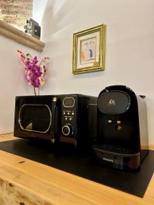 Příslušenství pro přípravu čaje a kávy v ubytování Koru House Ariccia