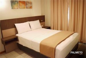 Letto o letti in una camera di Hotel Mega