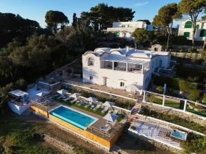 an aerial view of a house with a swimming pool at My Exclusive Italy - Elegant Villa in Anacapri Infinity Pool & Design in Anacapri