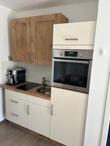 Kuchyň nebo kuchyňský kout v ubytování Babsi Appartments - leben am Land