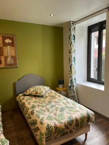 Кровать или кровати в номере Les Haltes de la Rive Gauche