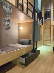 a bedroom with a bunk bed in a house at Skylark bangkok 云雀 in Bangkok