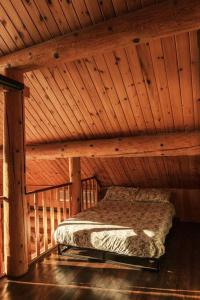 Cama o camas de una habitación en Le Petit Domaine Caché - Lac-Simon