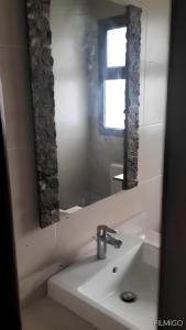 a bathroom with a sink and a mirror at Sand Castle Villa Azha - 2 bedrooms - Next Tanoak Hotel in Ain Sokhna