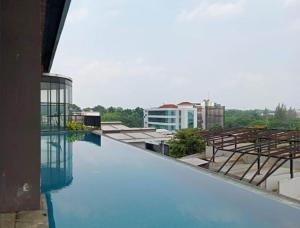 The swimming pool at or close to The Cozy Rooms at The Ayoma Residence, BSD Serpong