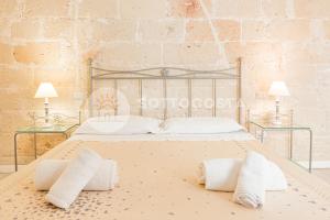 Postel nebo postele na pokoji v ubytování InCentro b&b