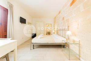 Postel nebo postele na pokoji v ubytování InCentro b&b
