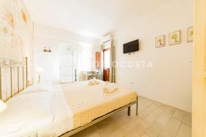 Postel nebo postele na pokoji v ubytování InCentro b&b