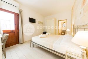 Postel nebo postele na pokoji v ubytování InCentro b&b