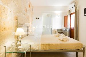 Postel nebo postele na pokoji v ubytování InCentro b&b