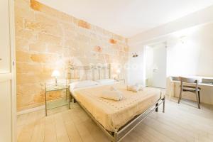 Postel nebo postele na pokoji v ubytování InCentro b&b
