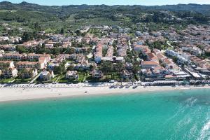 an aerial view of a beach with a resort at Victoria House Pefkohori 3 bedrooms 12 guests in Pefkohori