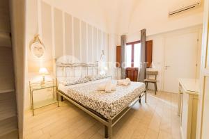 Postel nebo postele na pokoji v ubytování InCentro b&b