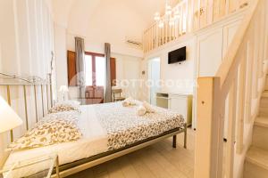 Postel nebo postele na pokoji v ubytování InCentro b&b