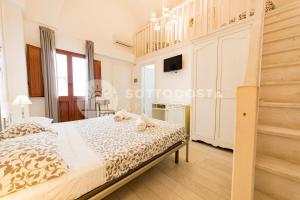 Postel nebo postele na pokoji v ubytování InCentro b&b