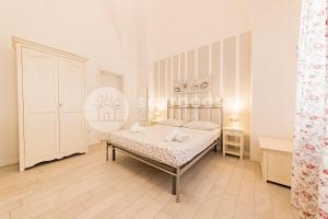 Postel nebo postele na pokoji v ubytování InCentro b&b + 33 fotografií