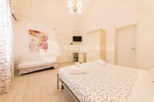 Postel nebo postele na pokoji v ubytování InCentro b&b
