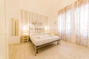 Postel nebo postele na pokoji v ubytování InCentro b&b