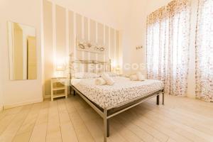 Postel nebo postele na pokoji v ubytování InCentro b&b