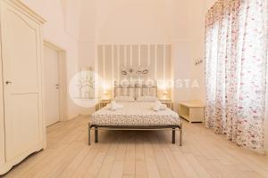 Postel nebo postele na pokoji v ubytování InCentro b&b