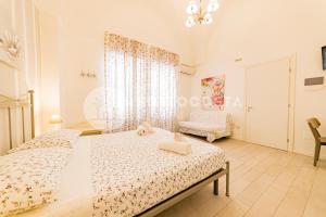 Postel nebo postele na pokoji v ubytování InCentro b&b