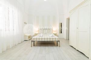 Postel nebo postele na pokoji v ubytování InCentro b&b