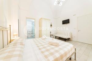 Postel nebo postele na pokoji v ubytování InCentro b&b