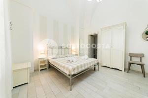 Postel nebo postele na pokoji v ubytování InCentro b&b
