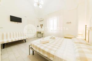 Postel nebo postele na pokoji v ubytování InCentro b&b