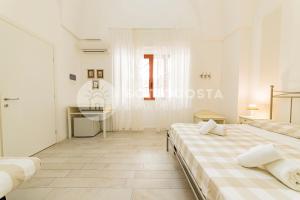 Postel nebo postele na pokoji v ubytování InCentro b&b