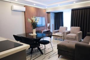 a living room with a table and chairs and a couch at No25 Suites Nisantasi in Istanbul