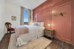 a bedroom with a large bed and a window at The Historic Grand Canyon Hotel in Williams