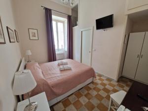A bed or beds in a room at B&B IL CEDRO