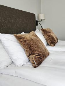 Postel nebo postele na pokoji v ubytování Hotel Skansen