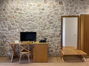 TV o dispositivi per l'intrattenimento presso Valta Hotel