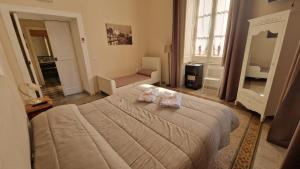 A bed or beds in a room at B&B IL CEDRO