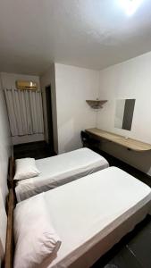 Postel nebo postele na pokoji v ubytování Pousada Vila Brumado + 16 fotografií