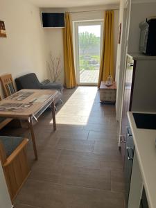 TV a/nebo společenská místnost v ubytování Babsi Appartments - leben am Land